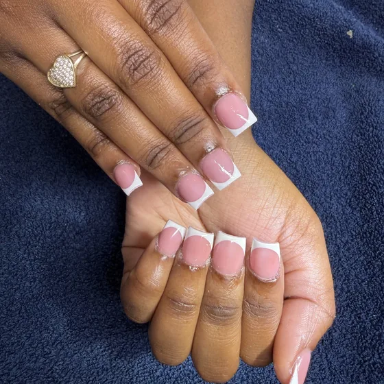 Close-up of pink-and-white square French tips.